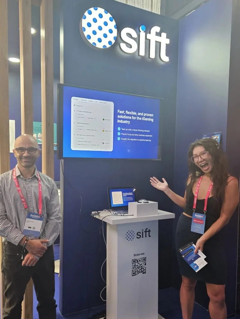 Sift staff presenting at the iGaming booth demo station.