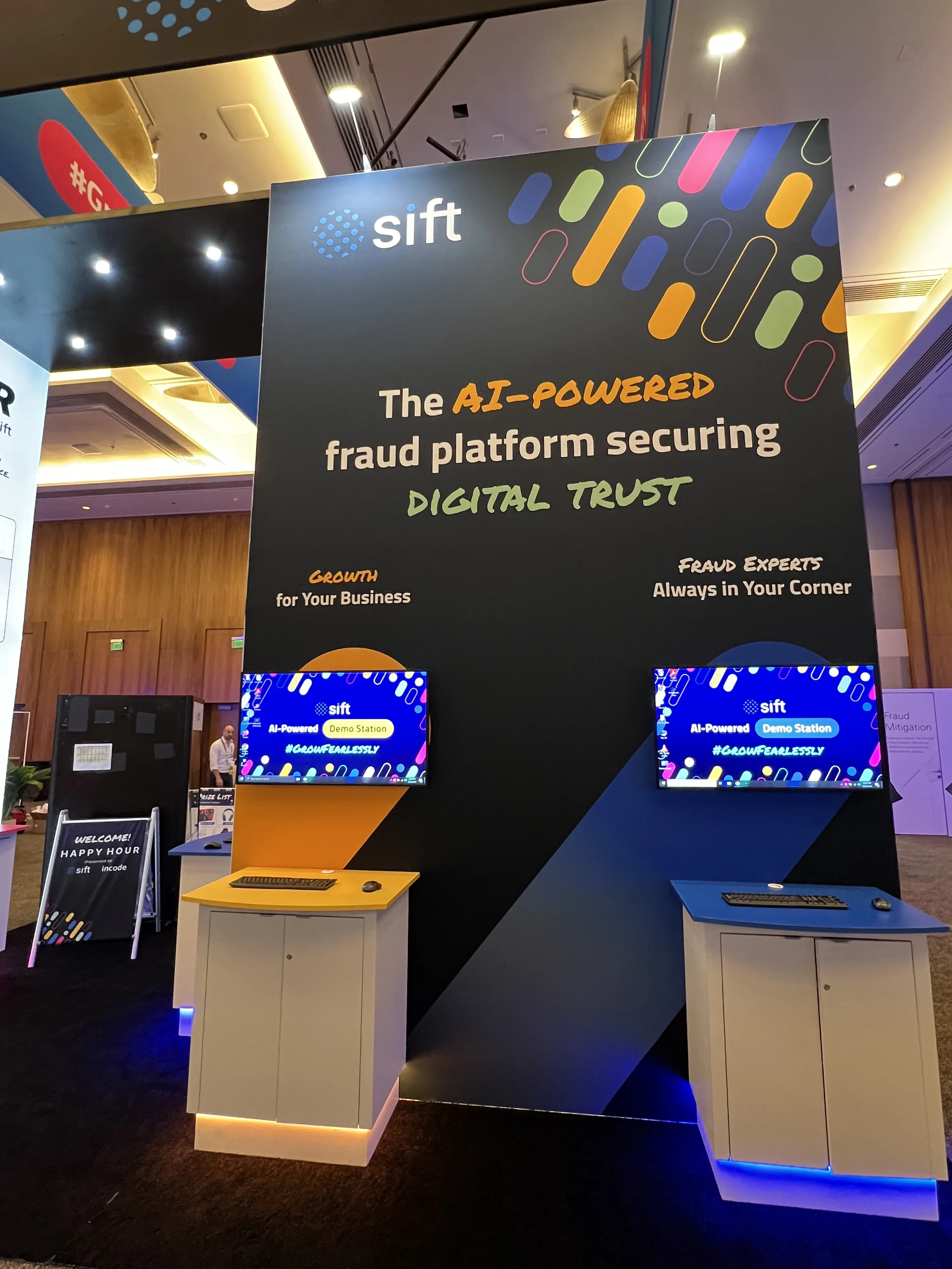 Sift MRC booth with an overhead marquee reading The AI-Powered Fraud Platform Securing Digital Trust and FIBR signage.